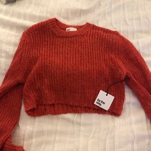 by the way. Cropped red sweater